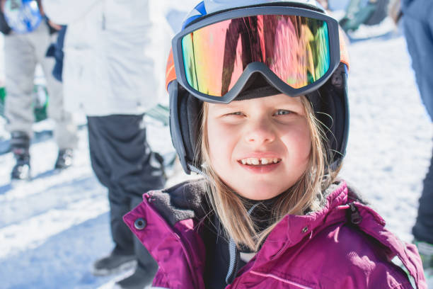 istock Girl with ski goggles and helmet 900200016
