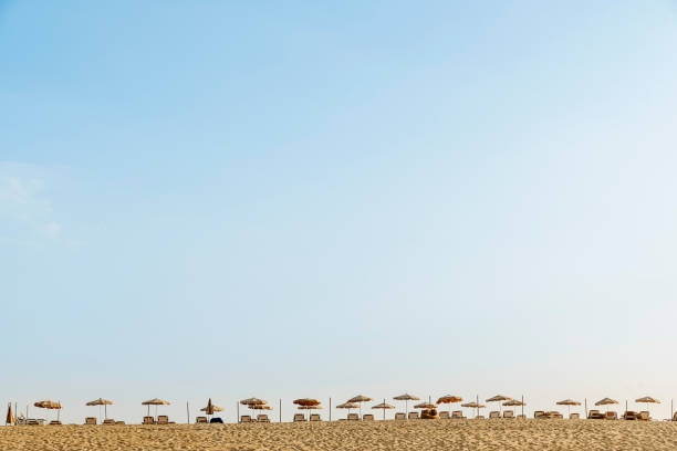 istock Umbrellas and relaxing chairs in the paradisaical beach. 900206478