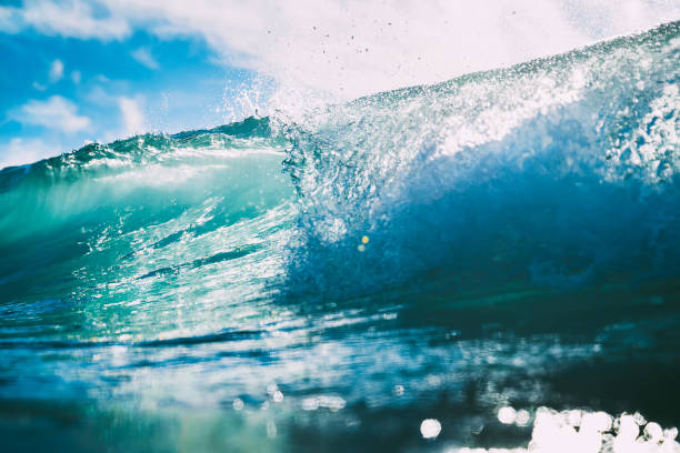 istock Blue wave in ocean. Crystal wave and sun light 900213664