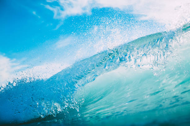 istock Blue wave in ocean. Clear wave and sun light 900213718