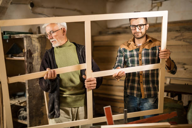 istock Young and senior carpenter 900216464