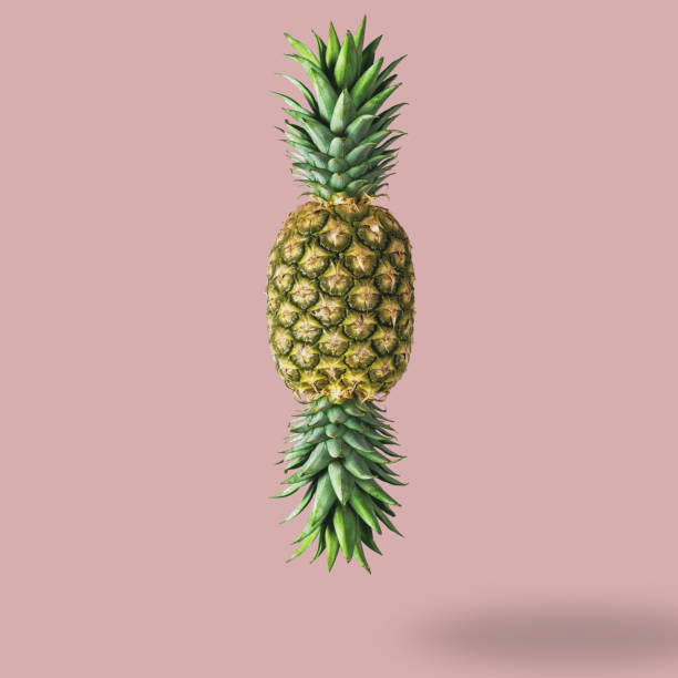istock Candy made of ripe pineapple on pink background. Minimal candy concept. 900238748