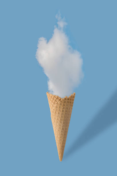 istock Ice cream cone and white cloud on pastel blue background. Flat lay. Minimal summer concept. 900238788