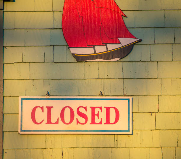 istock closed sign on wooden shingles 900242118