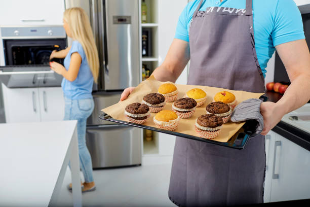 istock A couple is preparing a capkake in the kitchen 900246326