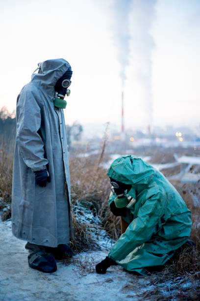 istock People in gas masks 900250186