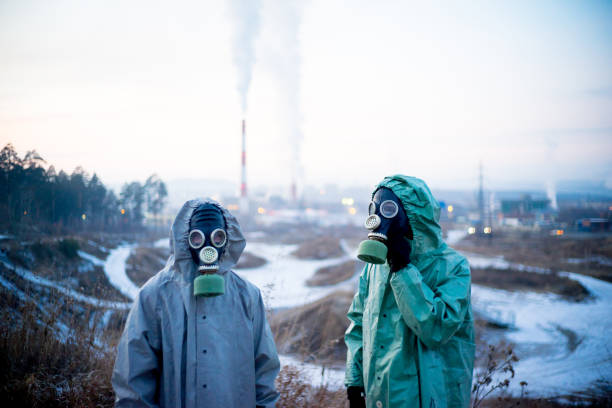 istock People in gas masks 900250398