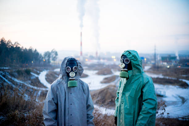 istock People in gas masks 900250588