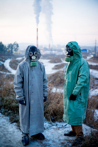 istock People in gas masks 900250724