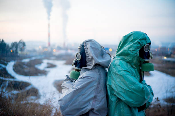 istock People in gas masks 900251196