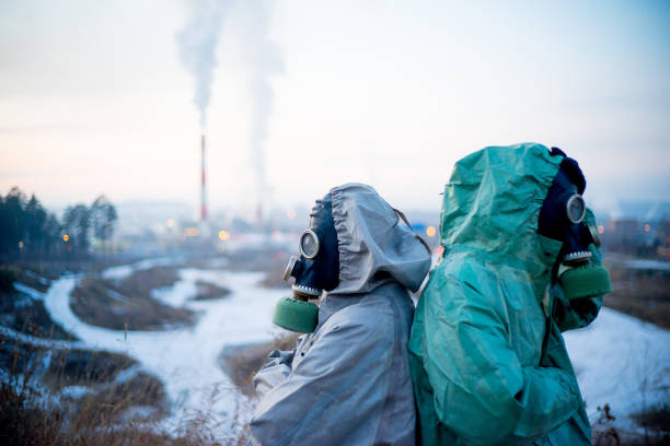 istock People in gas masks 900251318