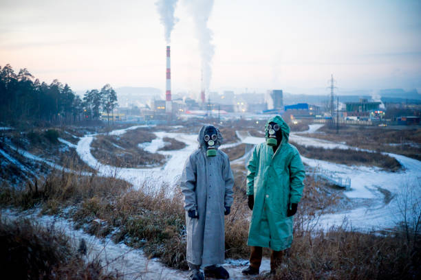 istock People in gas masks 900251514