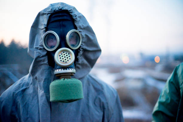 istock People in gas masks 900251826