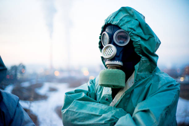 istock People in gas masks 900251916
