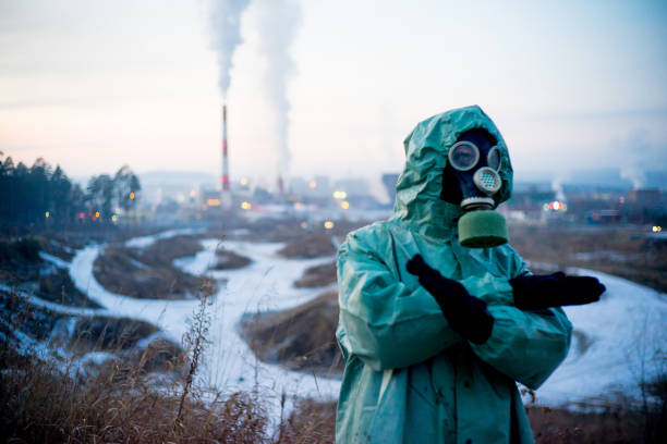 istock People in gas masks 900256352