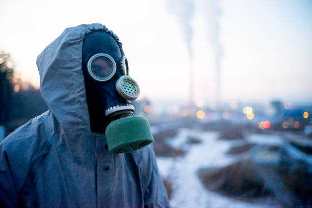 istock People in gas masks 900256700