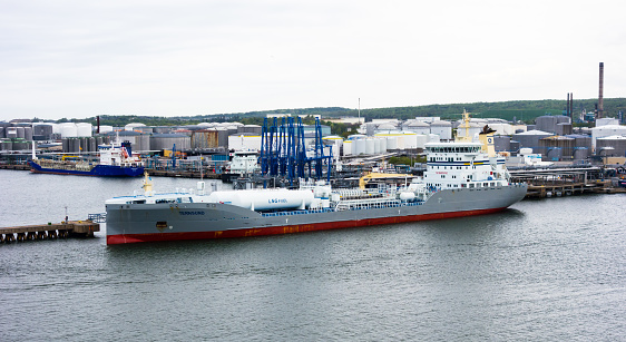 Gothenburg, Sweden - May 16, 2017: The tanker ship Ternsund is docked near storage tanks in Gothenburg harbor.