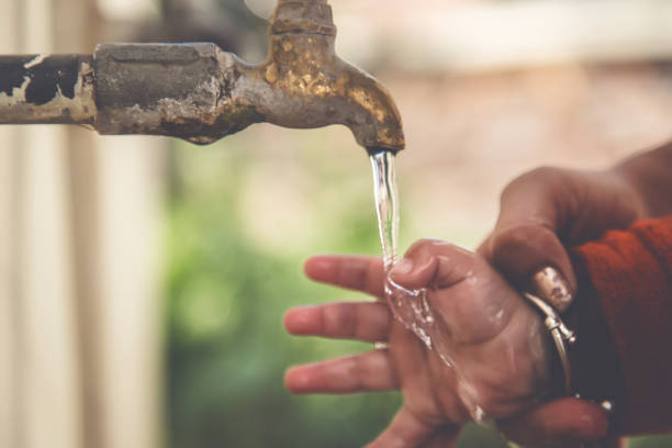 istock Mother and Child Hands Under Tap water 900258728