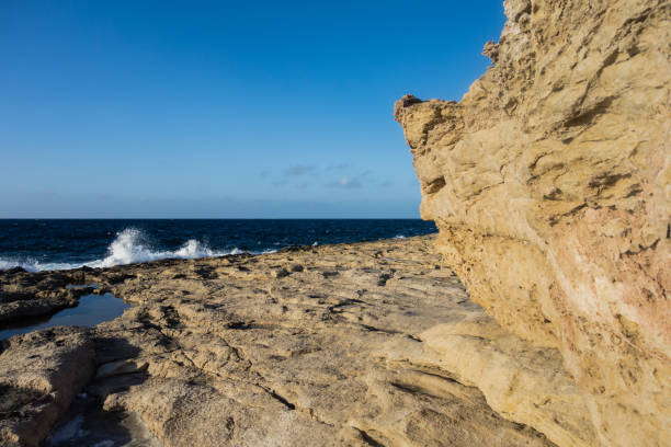 istock Rocky coastline and blue sky in Malta. 900259168
