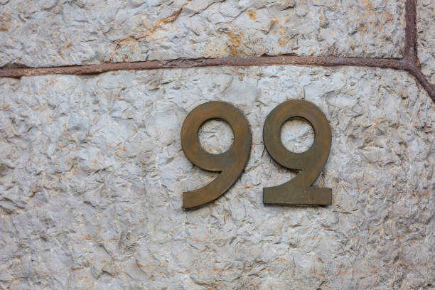 istock Number 99 (ninetynine) on a building in Barcelona, Spain 900272420