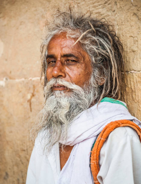 istock In Varanasi, serious sadhu looking at the camera. 900281056