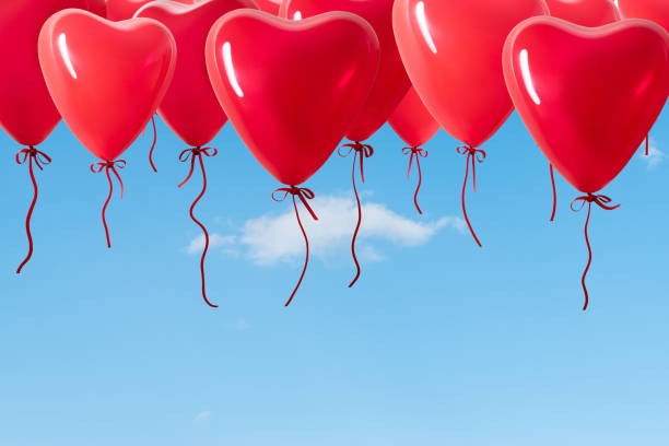 istock Heart shaped balloons on background of sky. 900288466