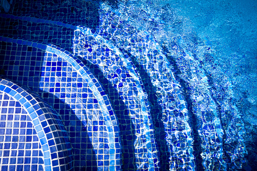 Blue tiled stairs in a swimming pool