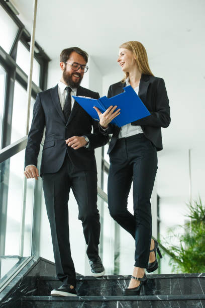 istock Business couple in friendly discussion 900288692