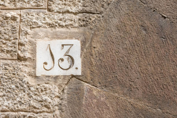 istock A house number thirteen (13) on a wall in Girona 900295024