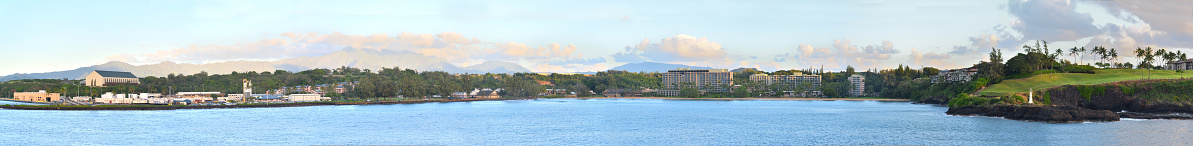 A Nawilliwilli harbor panoramic from the commercial pier on the left to the Hokuala golf course on the right with the tourist resorts, Kalapaki Beach and Nahwilliwilli park in the middle.