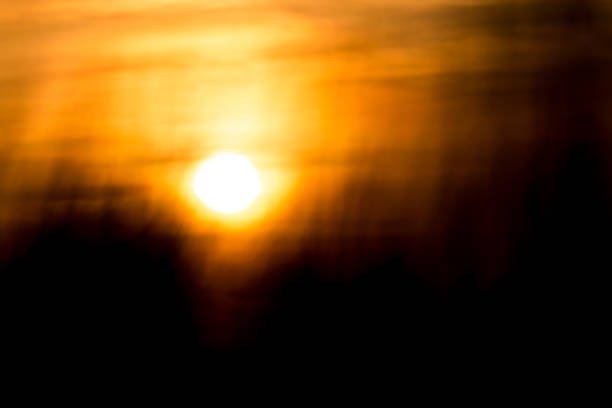 istock Blurred sunset background in the field with grass 900302116