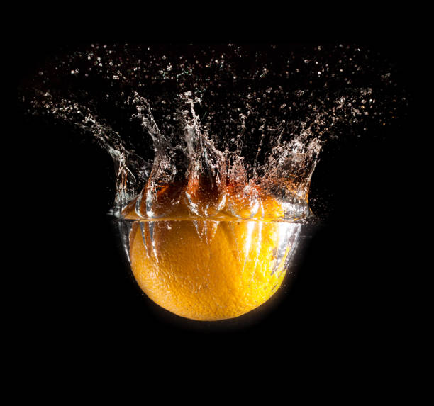 istock Orange under water on a black background 900303168