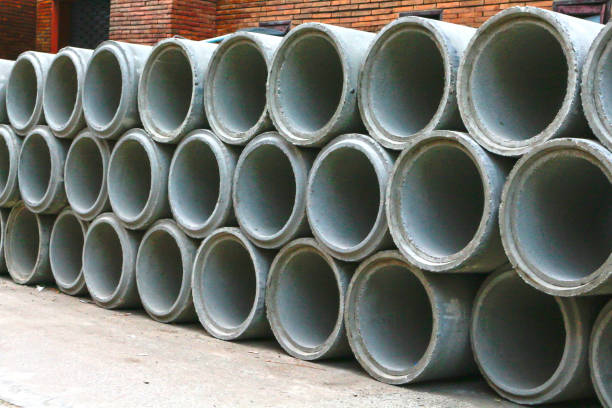 istock Concrete drainage pipes for industrial building construction 900306212