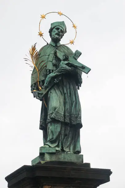 Nepomuk statue at St. Charles Bridge in Prague, Europe.