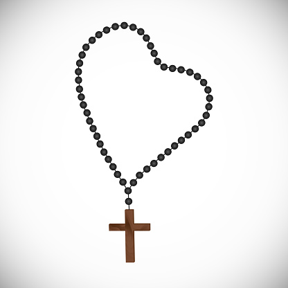 Catholic prayerful Rosary with black pearls with a wooden cross.