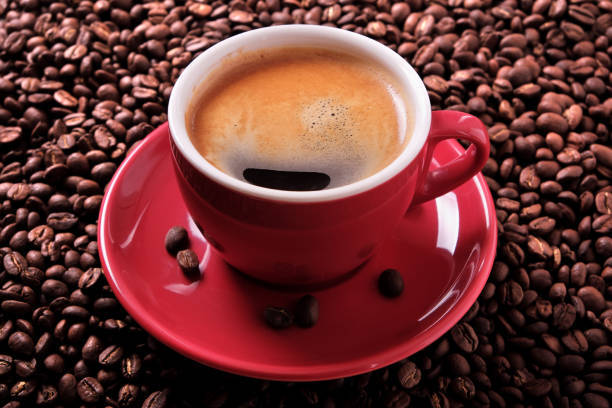 istock Red coffee cup with espresso and roasted beans close up 900322052