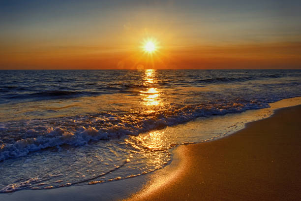 istock Sunset at sea from the beach 900325346