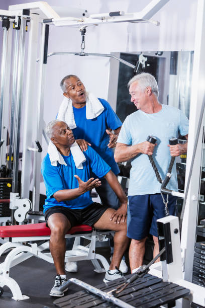 istock Three senior multi-ethnic men working out at gym 900348526