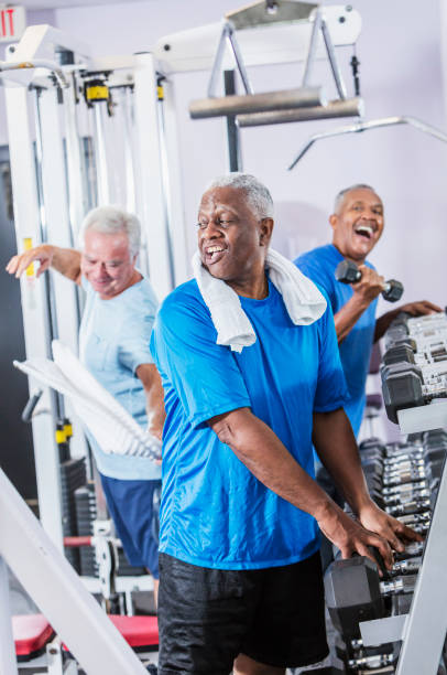 istock Three senior multi-ethnic men working out at gym 900349062