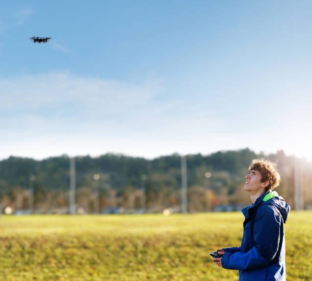 istock Teenage Boy Flying Drone 900357096
