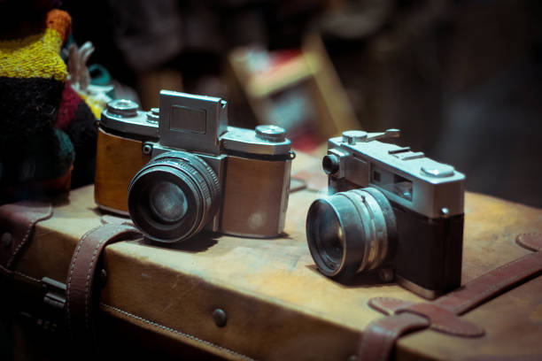 istock Old retro cameras on vintage suitcase 900360010