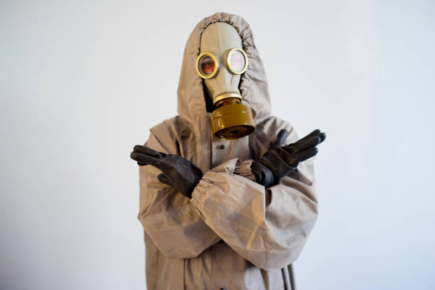 istock People in gas masks 900360132