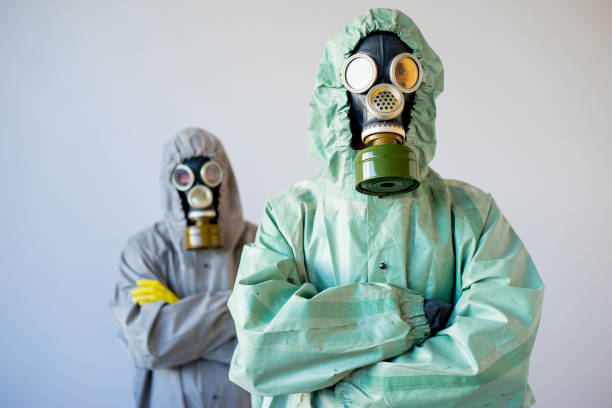 istock People in gas masks 900360416