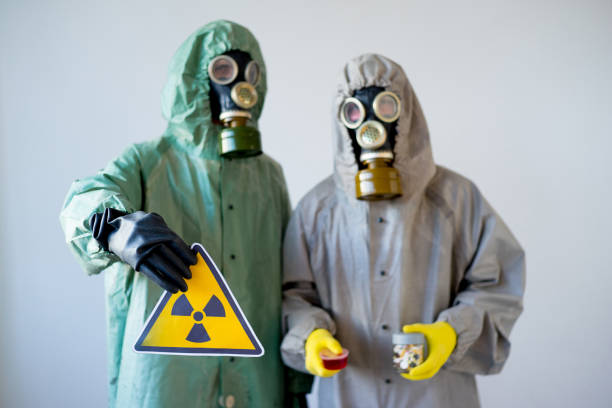 istock People in gas masks 900360788