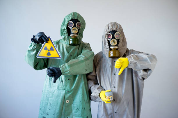 istock People in gas masks 900362852