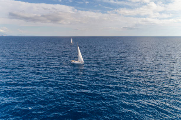 istock White yacht under a white sail. Montenegro. 900362902