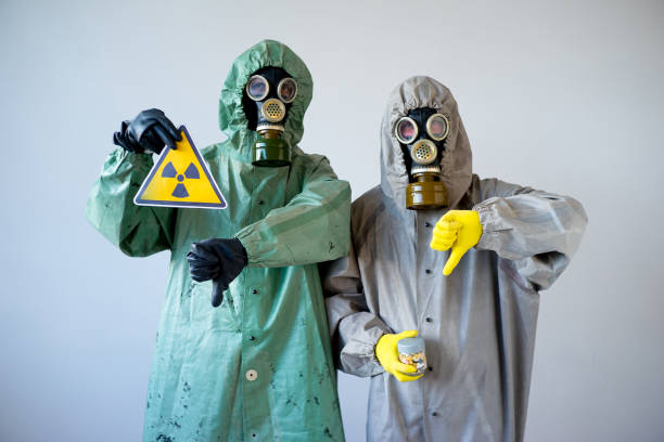 istock People in gas masks 900362938