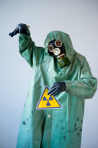 istock People in gas masks 900362964