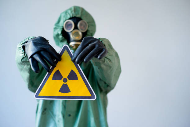 istock People in gas masks 900363072