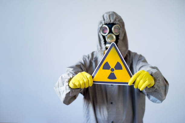istock People in gas masks 900363134